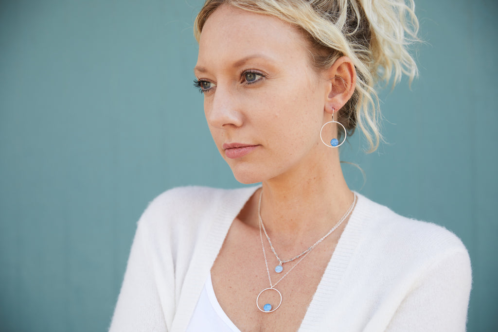 model wearing the front and center necklace layered with the unity necklace for multiple sclerosis research