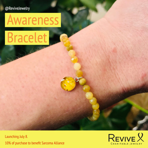 sarcoma alliance awareness bracelet on wrist
