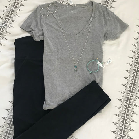 athleisure outfit with black leggins and gray tee shirt paired with teal jewelry for ovarian cancer, Alzheimer's and infertility awareness