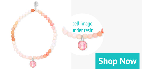 breast cancer awareness bracelet in pink opal with round resin pendant