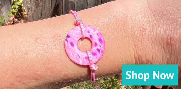 breast cancer awareness bracelet in pink adjustable cord