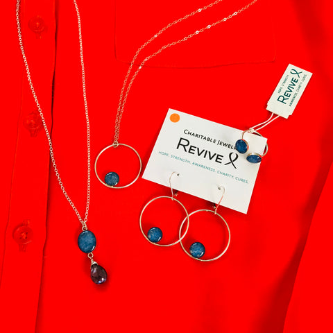 close up of orange shirt with blue jewelry for multiple sclerosis awareness