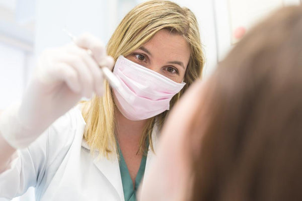 doctor examines patient