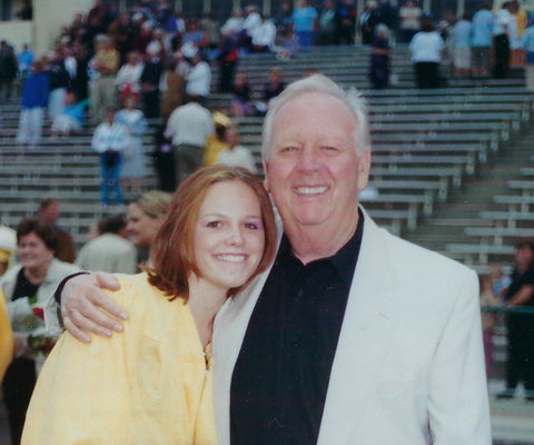 Nikki and grandpa Mike at high school graduation