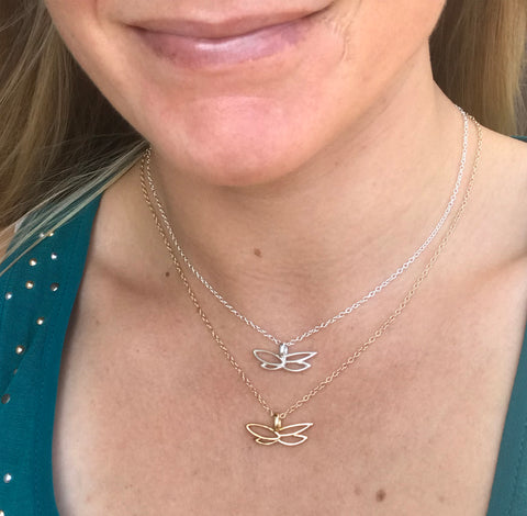 Nikki wearing silver and gold filled butterfly for breast cancer research necklaces