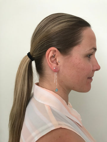 side pony tail and thread of hope earrings for alzheimer's awareness