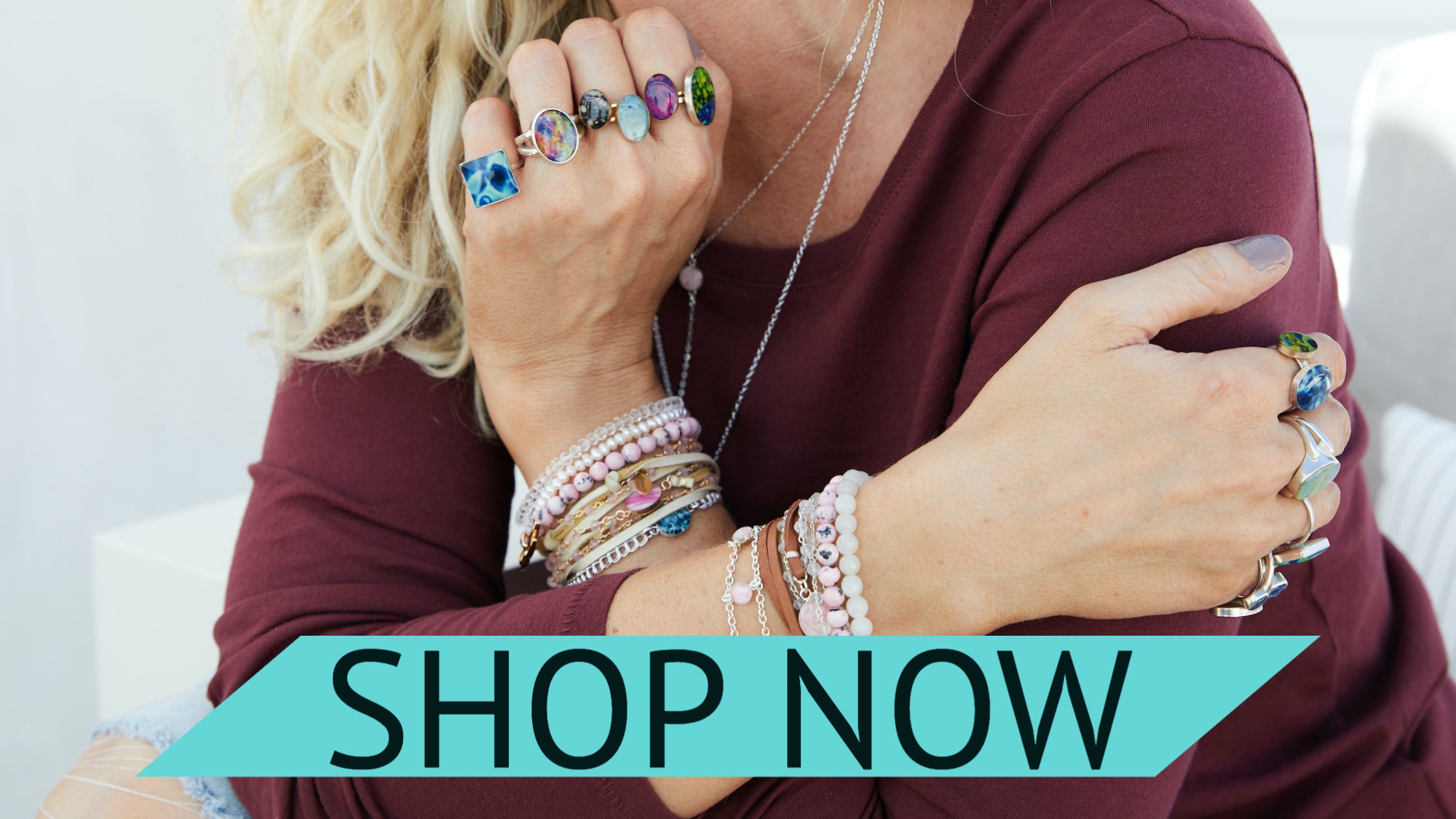 model wearing stacked up rings and bracelets for a cause