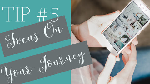 woman holding phone looking at social media tip #5 focus on your journey