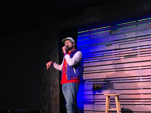 Zack Hillman doing stand up at a comedy club