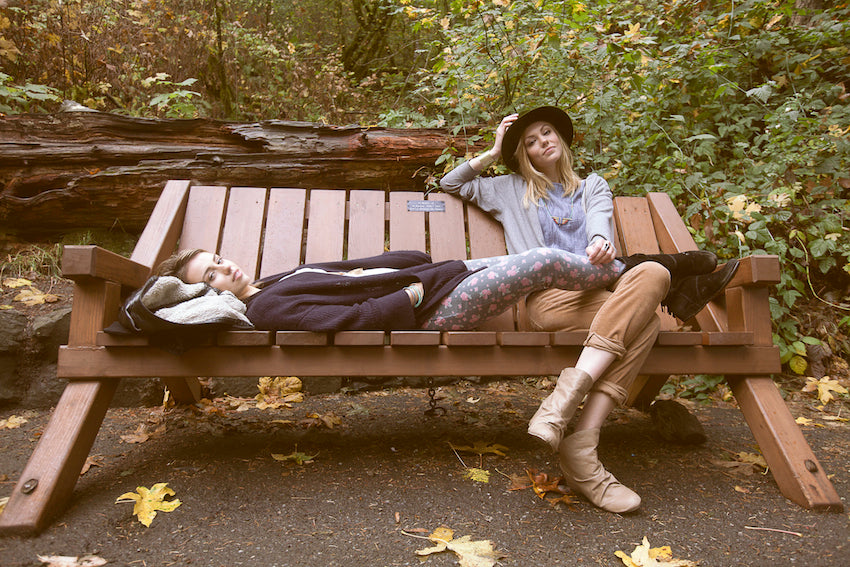 Two models sitting on a bench on the Multnomah Falls trail to take a break.