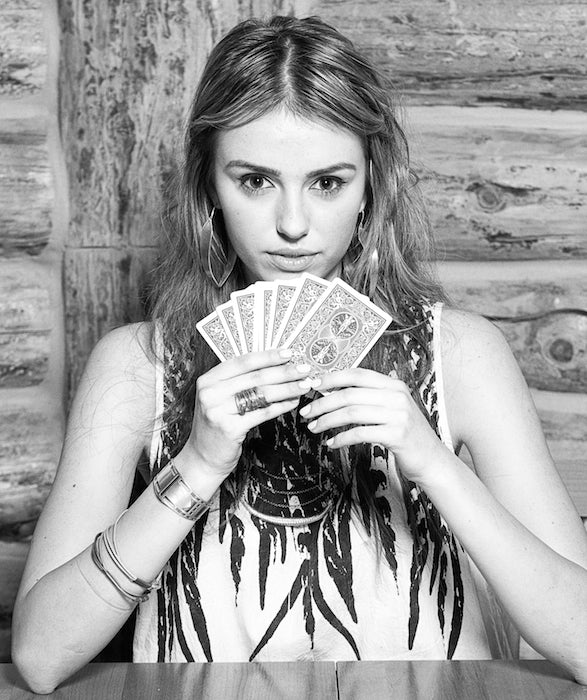 Intense model stare while playing cards.