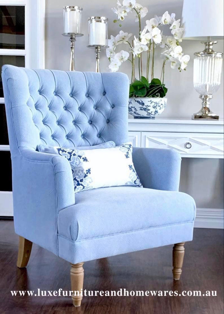 white tufted armchair