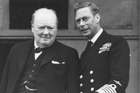 The King, alongside Winston Churchill, on the balcony of Buckingham Palace during VE Day celebrations.
