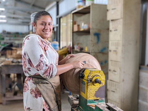 Jasmine using machinery in the carpentry shop at Mission Lazarus Honduras