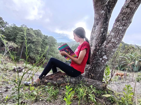 Claudette studying at her house