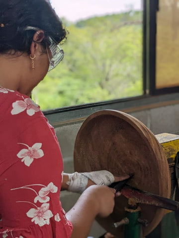 Jasmine turns a wood bowl in the carpentry shop at Mission Lazarus Honduras