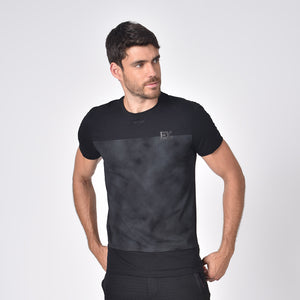 Model in black, short-sleeve cotton crew-neck with distorted grey print and silicone "EX" logo.