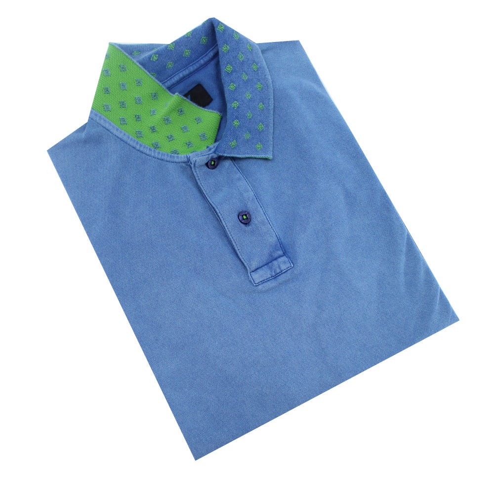 Powder-blue polo with two-button placket and reversible diamond-grid jacquard collar: lime green on reverse.