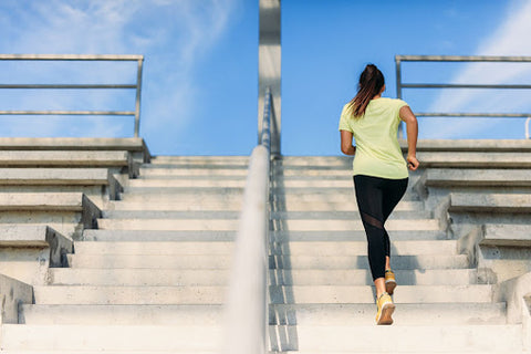 woman running upstairs