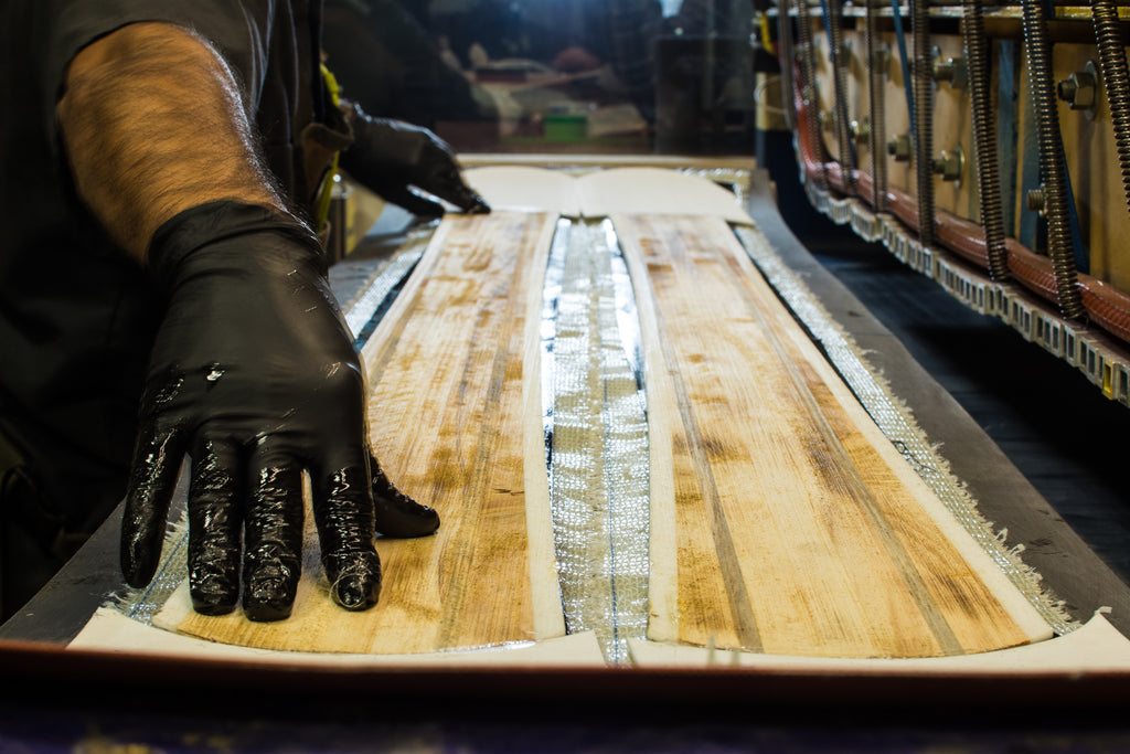 A man builds custom skis at Meier Skis in Denver, CO