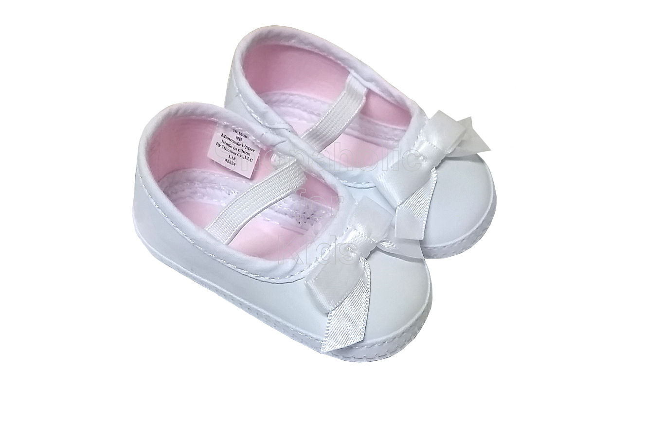 newborn white shoes girl