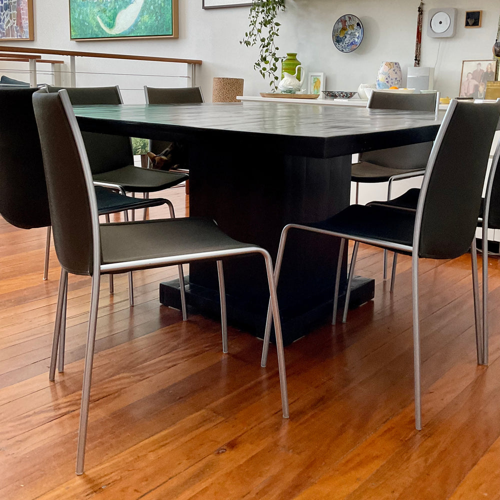 four black dining chairs