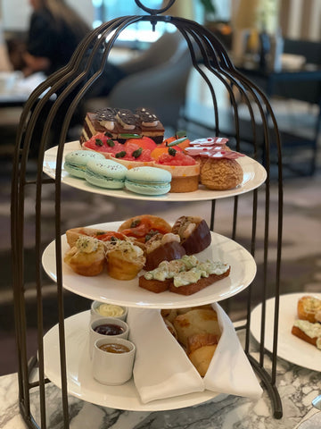 Tiered cake stand with savouries and sweets