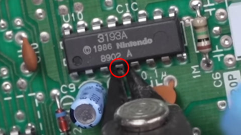 Lockout pin on NES motherboard