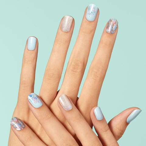 Dashing Diva GLOSS Nuclear Nova baby blue gel nail strips with mosaic, shattered glass, and glitter accents.