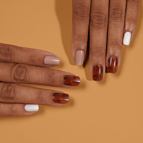 Dashing Diva MAGIC PRESS Slow and Steady medium, square neutral and white press on gel nails with tortoise shell accent nails.