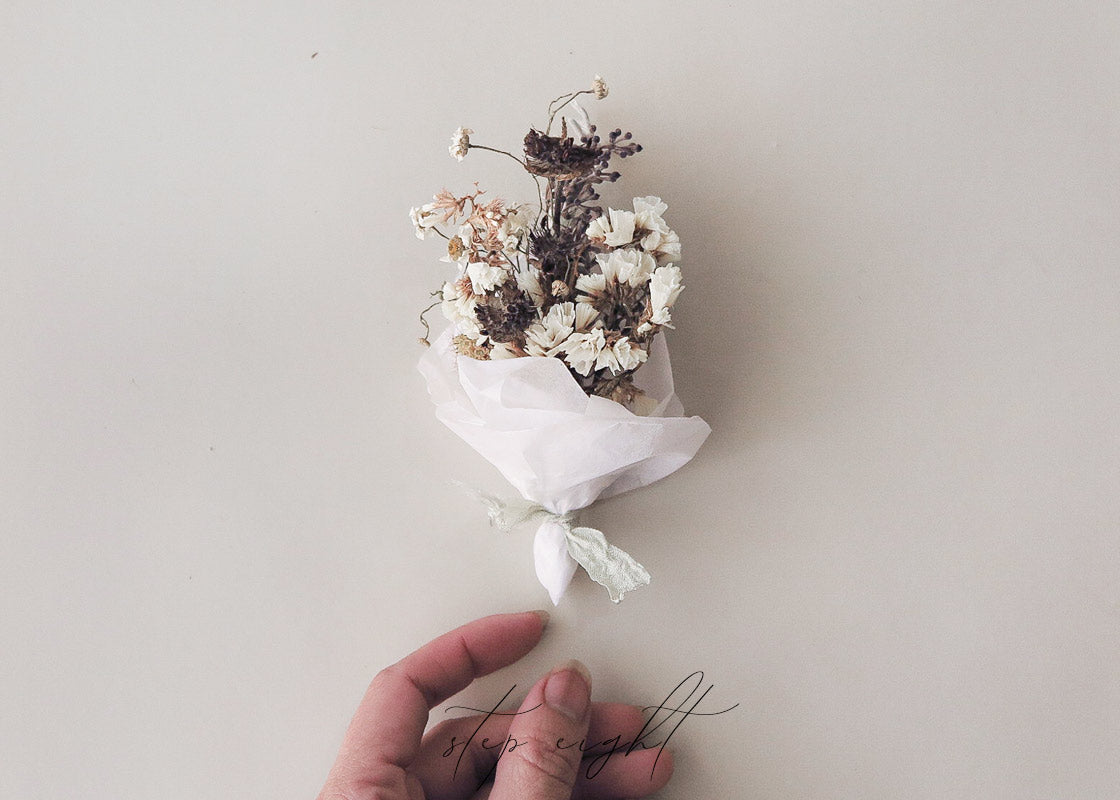 Mini Dried Flower Bouquet with Newspaper Wrap Stock Photos