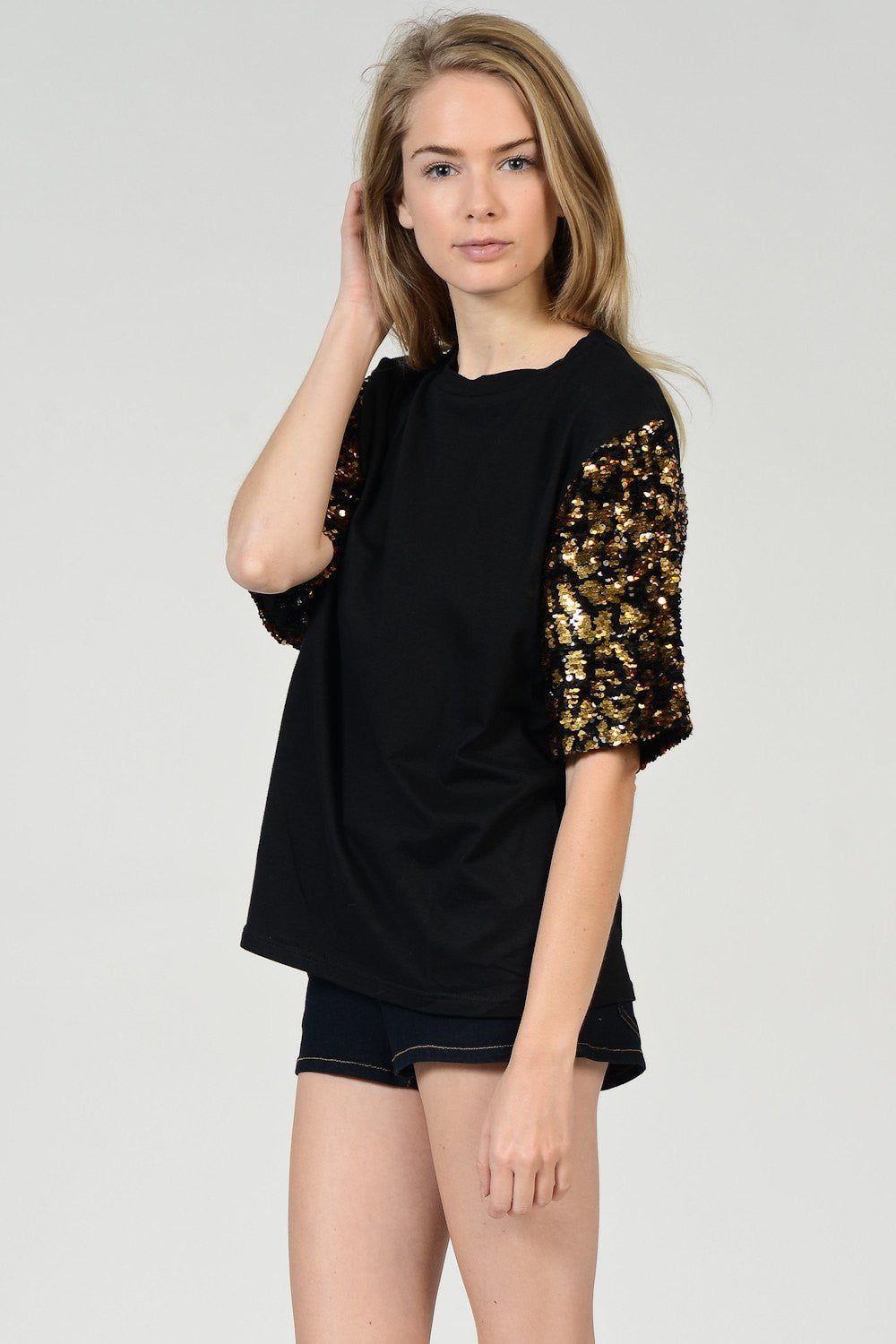 black shirt with sequin sleeves