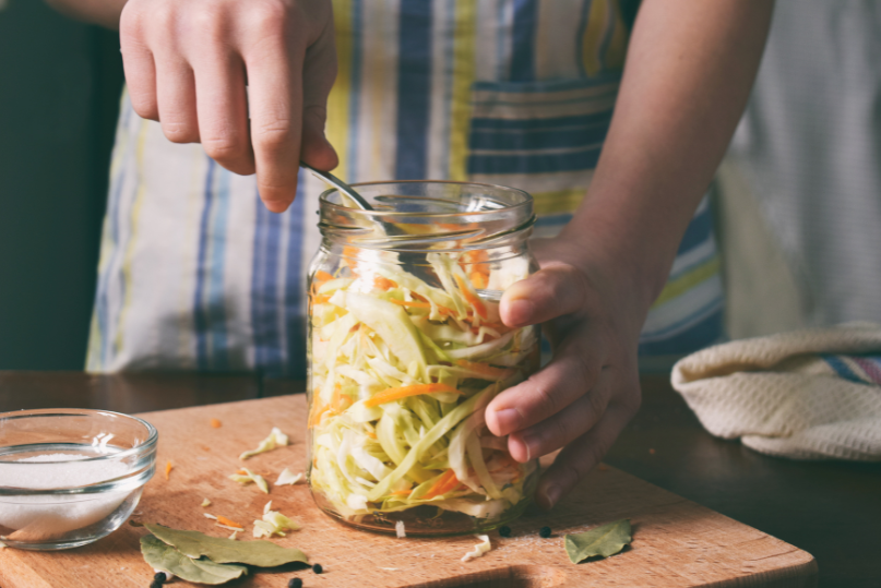 Home made sauerkraut starts with cabbage in a jar