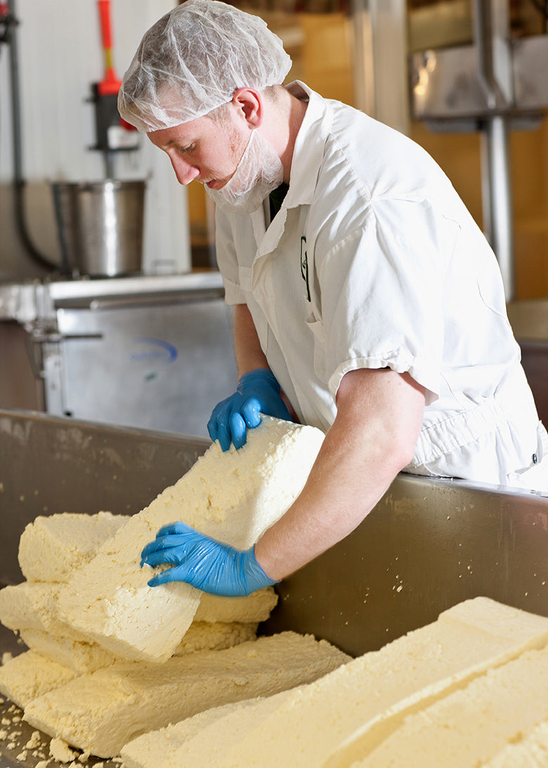 Handling fresh cheese at Grafton Village Cheese