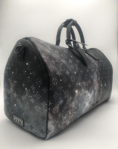 Louis Vuitton | Keepall Bandouliere Monogram Galaxy | M44166– The-Collectory