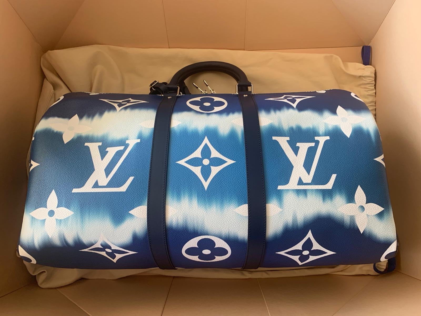 Louis Vuitton Keepall Bandouliere Clouds Monogram 50 Blue in Coated Canvas  with Silver-toneLouis Vuitton Keepall Bandouliere Clouds Monogram 50 Blue  in Coated Canvas with Silver-tone - OFour