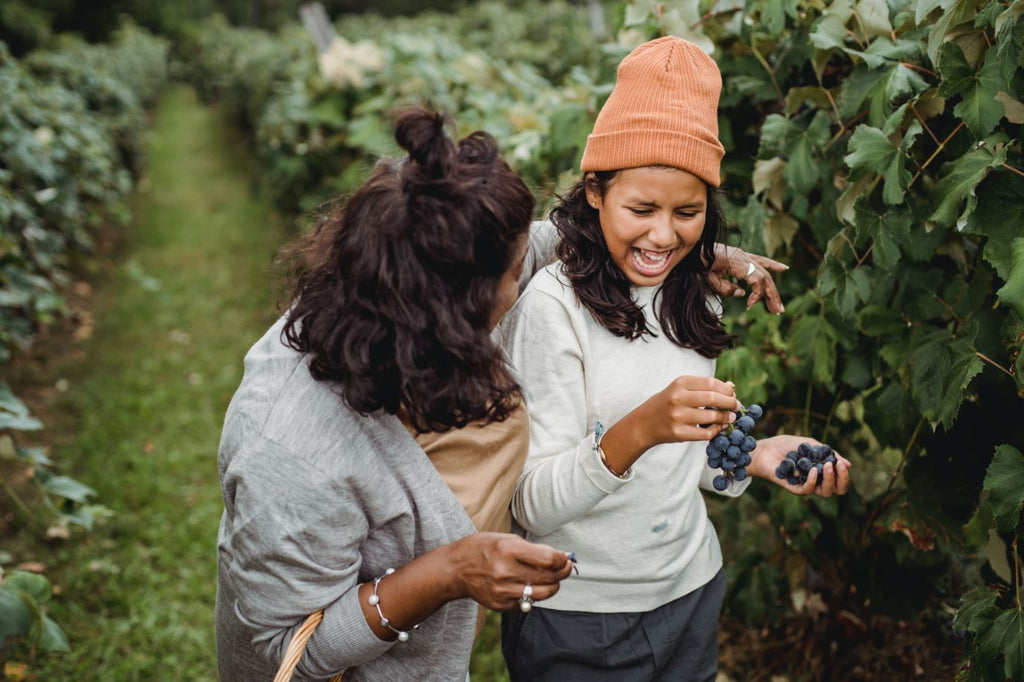 Mom with her daughter in an orchard