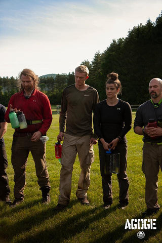 Rachel Lotz lined up with other Spartan Competitors as they hydrate for the next AGOGE Challenge