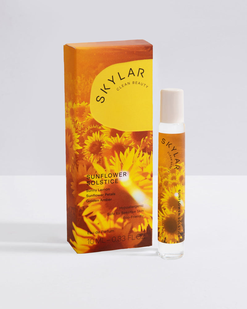 Sunflower Solstice fragrance: Travel-size bottle with a floral citrus scent displayed next to box.