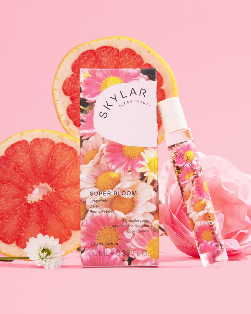 Super Bloom fragrance: Travel-size fragrance in a floral scent surrounded by grapefruit and flowers.