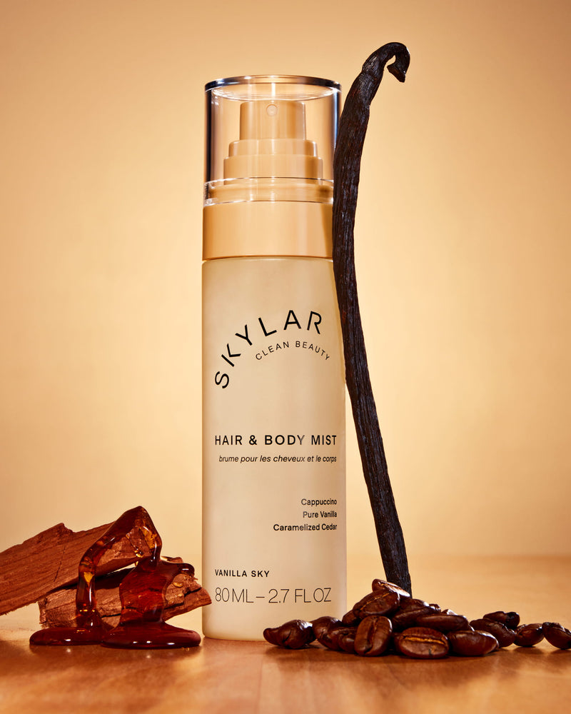 Skylar Vanilla Sky Hair & Body Mist: Travel-size body spray in a gourmand scent next to its box.