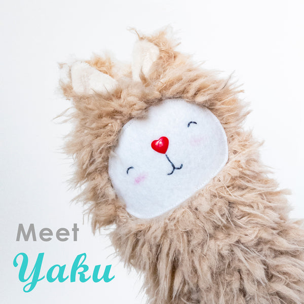 Picture of a stuffed llama with the text"Meet Yaku"