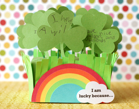 Paper cut clover with a rainbow