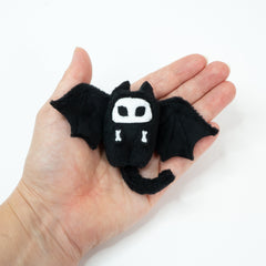 Tiny bat plushie hold in a hand