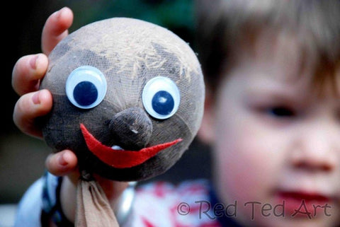 Grass head hold by a little kid