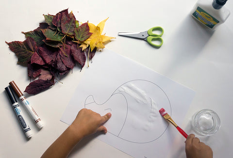 Picture of automn leaves and a kid hand 