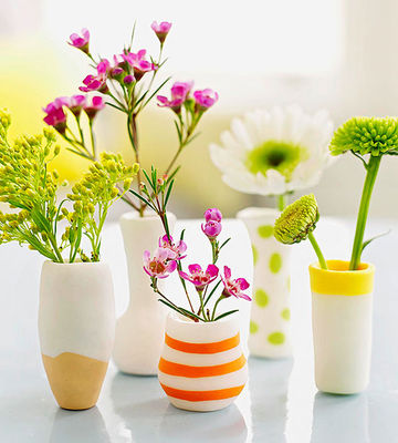 Vase made out of clay with flowers