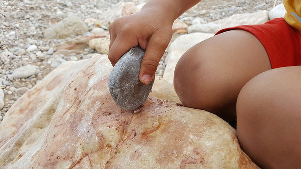 Making powder paint with a rock