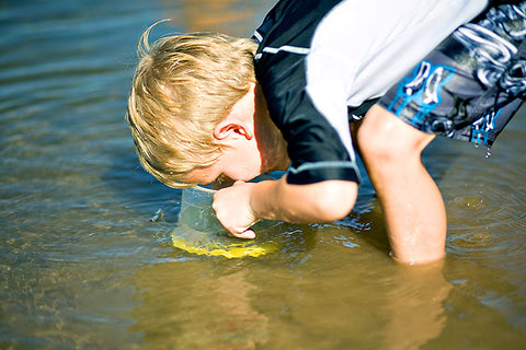 Kids looking under water