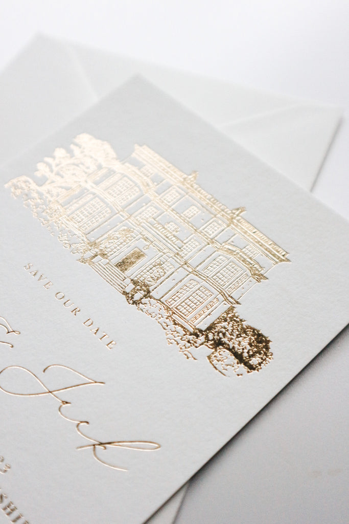 gold foil pressed save the dates with wedding venue illustration
